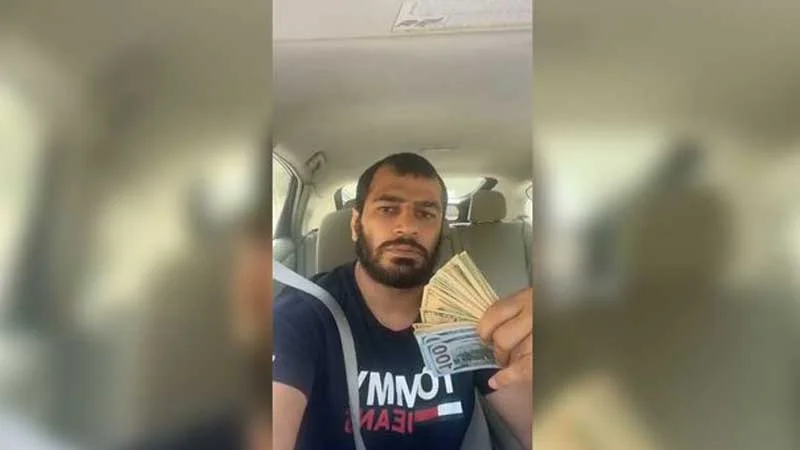 Millimizin üzvündən növbəti “pul şousu”: Bu dəfə dollarla özünü yellədi - VİDEO 